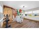Versatile bonus room with wooden floors, accent wall, barn door, and multiple windows at 440 42Nd N St, St Petersburg, FL 33713