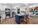 Kitchen featuring stainless steel appliances, kitchen island and view into bonus room at 440 42Nd N St, St Petersburg, FL 33713