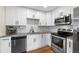 Updated kitchen with stainless steel appliances and white subway tile backsplash at 440 42Nd N St, St Petersburg, FL 33713