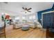 Bright living room with hardwood floors, a ceiling fan, and ample natural light, creating a welcoming atmosphere at 440 42Nd N St, St Petersburg, FL 33713