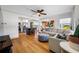 Open-concept living room with hardwood floors, seamlessly connected to the modern kitchen, creating an inviting living space at 440 42Nd N St, St Petersburg, FL 33713
