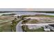 Wide aerial view of the event venue with lake and palm trees at 4696 Del Sol Blvd, Sarasota, FL 34243