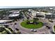 An aerial view of a landscaped roundabout in a commercial area at 4696 Del Sol Blvd, Sarasota, FL 34243
