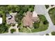 A high-angle shot of the property highlighting its location on a manicured lot with nearby golf course at 4696 Del Sol Blvd, Sarasota, FL 34243
