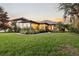 Expansive backyard with lush landscaping and a well-manicured lawn at 4696 Del Sol Blvd, Sarasota, FL 34243