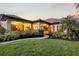 Lush backyard with landscaping and a brick path at 4696 Del Sol Blvd, Sarasota, FL 34243