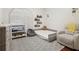 Neutral bedroom with a sleek gray rug, soft chair, and modern baby furniture at 4696 Del Sol Blvd, Sarasota, FL 34243