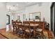 Elegant dining room with wood table and chairs, ornate mirror, and access to other rooms at 4696 Del Sol Blvd, Sarasota, FL 34243
