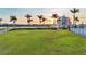 Aerial shot of green field near lake and modern building at 4696 Del Sol Blvd, Sarasota, FL 34243
