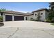 Attached three-car garage with an extended paved driveway offers ample parking at 4696 Del Sol Blvd, Sarasota, FL 34243
