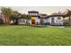 Home exterior with a lush lawn and a bubbling fountain at 4696 Del Sol Blvd, Sarasota, FL 34243