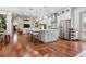 Open-concept kitchen with island seating, stainless steel appliances, and seamless flow to the living area at 4696 Del Sol Blvd, Sarasota, FL 34243