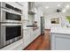 Well-equipped kitchen featuring stainless steel appliances, stylish backsplash, and sleek cabinetry at 4696 Del Sol Blvd, Sarasota, FL 34243