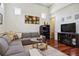 Bright living room showcasing wood floors, a gray sofa, and recessed lighting at 4696 Del Sol Blvd, Sarasota, FL 34243