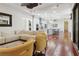 Bright open-concept living area with a large sofa, chairs, and seamless connection to the kitchen at 4696 Del Sol Blvd, Sarasota, FL 34243