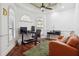 Bright office with hardwood floors, arched windows, computer setup, and comfortable seating area at 4696 Del Sol Blvd, Sarasota, FL 34243