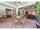 Expansive covered patio with brick flooring, ceiling fans, and multiple seating areas for entertaining guests at 4696 Del Sol Blvd, Sarasota, FL 34243