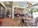 Large covered patio with brick flooring, ceiling fans, and an abundance of seating for relaxed outdoor living at 4696 Del Sol Blvd, Sarasota, FL 34243