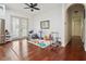 Spacious playroom with bright natural light, hardwood floors, and access to the backyard at 4696 Del Sol Blvd, Sarasota, FL 34243