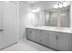 Elegant bathroom featuring double vanity, and white marble countertops at 4988 Fairhope Cir, Lakewood Ranch, FL 34211