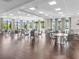 Large meeting room with hardwood floors, ample seating, and plenty of natural light at 4988 Fairhope Cir, Lakewood Ranch, FL 34211