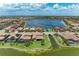 Breathtaking aerial view of a beautiful community with sprawling lake and picturesque homes at 501 Maraviya Blvd, Nokomis, FL 34275