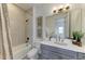 Stylish bathroom features a tiled shower over tub combination, a vanity, and modern fixtures at 501 Maraviya Blvd, Nokomis, FL 34275
