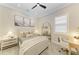 Bright bedroom with a comfortable bed, a writing desk, and stylish decor at 501 Maraviya Blvd, Nokomis, FL 34275