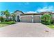 Beautiful single-Gathering home with a two car garage and large brick paver driveway at 501 Maraviya Blvd, Nokomis, FL 34275
