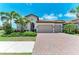 Beautiful single-Gathering home with a two car garage and large brick paver driveway at 501 Maraviya Blvd, Nokomis, FL 34275