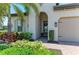Charming front entrance with brick walkway, manicured landscaping, and welcoming doorway at 501 Maraviya Blvd, Nokomis, FL 34275