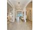 Hallway with high ceilings leads to a living area with water views and offers space for decor at 501 Maraviya Blvd, Nokomis, FL 34275