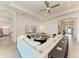 Spacious living room with a plush sofa, large TV, and access to other areas of the home at 501 Maraviya Blvd, Nokomis, FL 34275