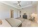 Spacious main bedroom with ample natural light, a decorative ceiling fan, and modern decor at 501 Maraviya Blvd, Nokomis, FL 34275