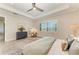 Bright, spacious main bedroom featuring large windows, tray ceiling, and stylish furnishings at 501 Maraviya Blvd, Nokomis, FL 34275