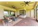 Expansive covered patio with dining and lounge areas, perfect for entertaining at 501 Maraviya Blvd, Nokomis, FL 34275