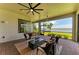 Covered patio area with comfortable seating and serene water views at 501 Maraviya Blvd, Nokomis, FL 34275