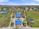 Aerial view showcasing the community amenities, including a clubhouse, playground, and tennis courts at 5047 Newport News Cir, Bradenton, FL 34211