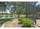 View of backyard and pond from the screened lanai at 5047 Newport News Cir, Bradenton, FL 34211