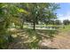 Scenic backyard view showcasing lush trees and a serene pond in a peaceful setting at 5047 Newport News Cir, Bradenton, FL 34211