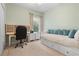 Cozy bedroom with a desk, daybed, and a bright window at 5047 Newport News Cir, Bradenton, FL 34211