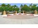 Decorative entrance to Central Park at Lakewood Ranch with brick accents and landscaping at 5047 Newport News Cir, Bradenton, FL 34211