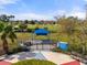 Clean and safe community dog park featuring benches and a covered area, perfect for socializing pets at 5047 Newport News Cir, Bradenton, FL 34211