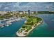 Stunning aerial view of the marina and waterfront homes, highlighting the community's coastal charm and boat access at 5074 Flagstone Dr, Sarasota, FL 34238
