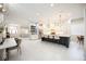 Bright, open kitchen features a large island, modern lighting, stainless steel appliances, and ample cabinet space at 5074 Flagstone Dr, Sarasota, FL 34238