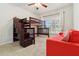 This bedroom offers a unique bunk bed, plus a convertible couch, creating a versatile and fun space at 5240 Silver Charm Ter, Wesley Chapel, FL 33544