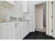 White cabinets with granite countertops feature in this kitchen space for lots of room at 5240 Silver Charm Ter, Wesley Chapel, FL 33544