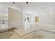 Bright open living space with sliding doors to the outside and white wainscotting at 5240 Silver Charm Ter, Wesley Chapel, FL 33544