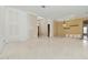 Bright living room featuring tile flooring, chandelier, and elegant architectural details at 5240 Silver Charm Ter, Wesley Chapel, FL 33544