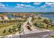Beautiful aerial view showcases a Primary-planned community, complete with scenic lakes and tree-lined streets at 5511 Foxfire Run, Lakewood Ranch, FL 34211